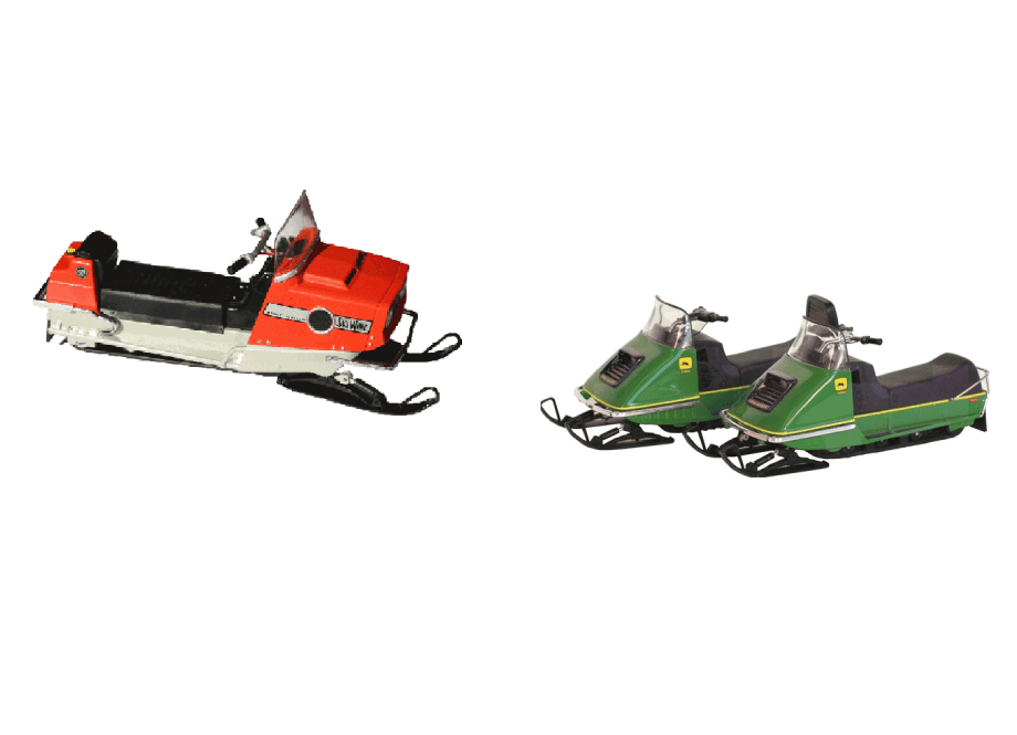 Two vintage snowmobiles, one red and one green, displayed side by side.
