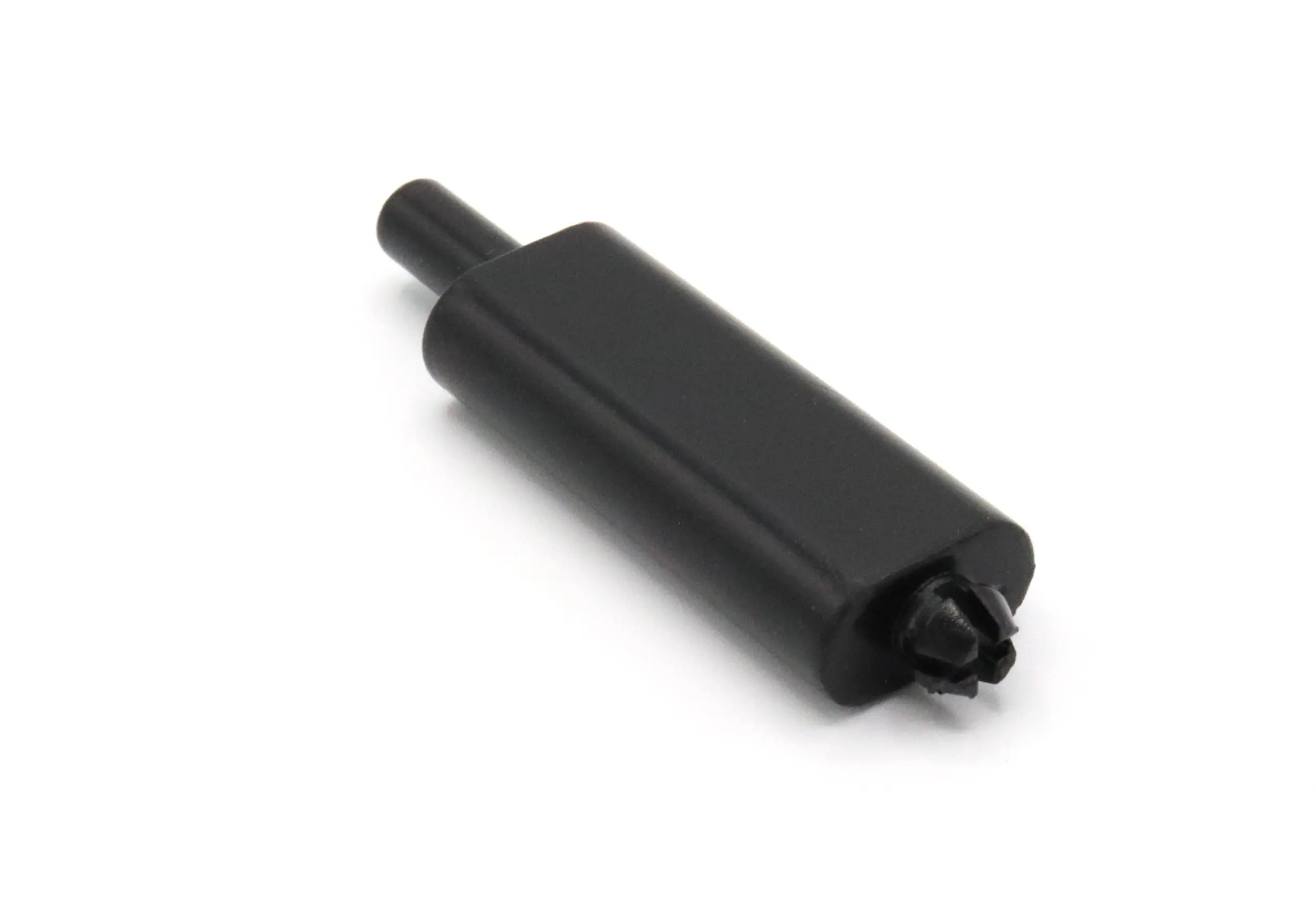 Black plastic muffler with a cylindrical shape and an outlet pipe.