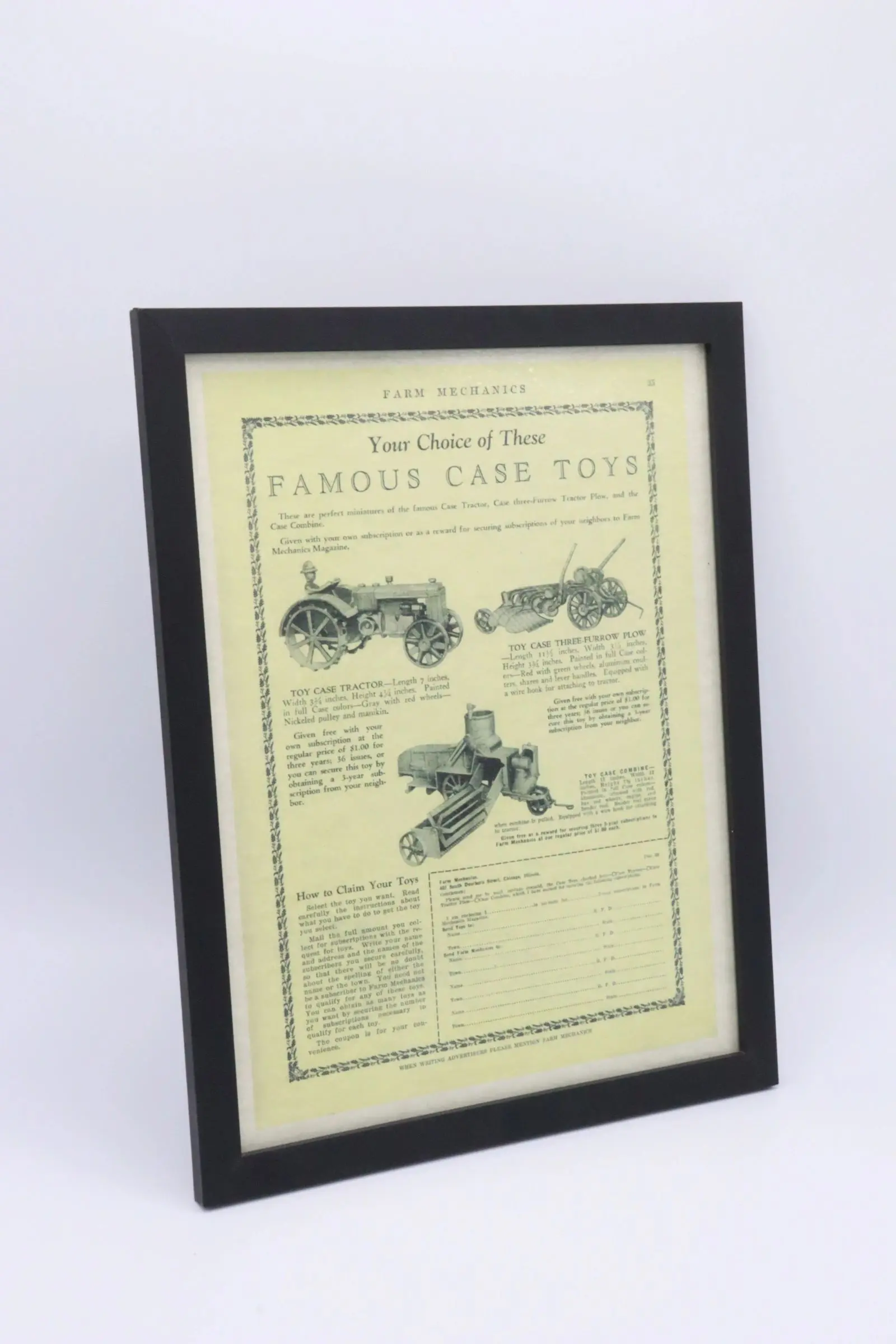 Framed vintage advertisement for family cars and toys.