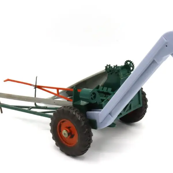 Vintage green and orange farming equipment with wheels and an auger.