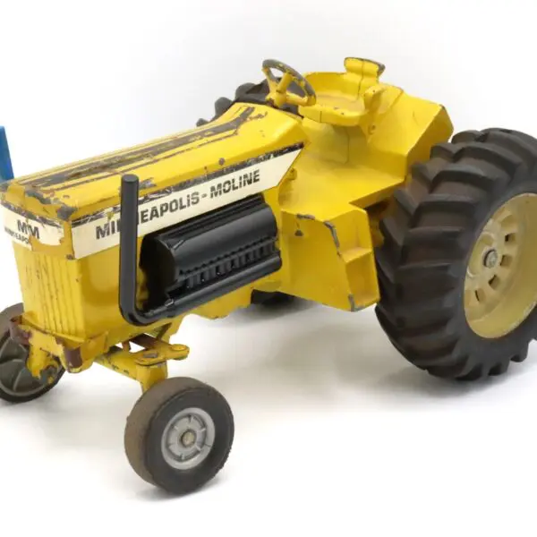 Yellow vintage tractor model with detailed design and large rear wheels.
