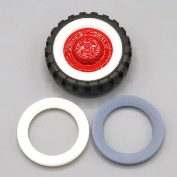 A black and white wheel with two color-coded circular rings.