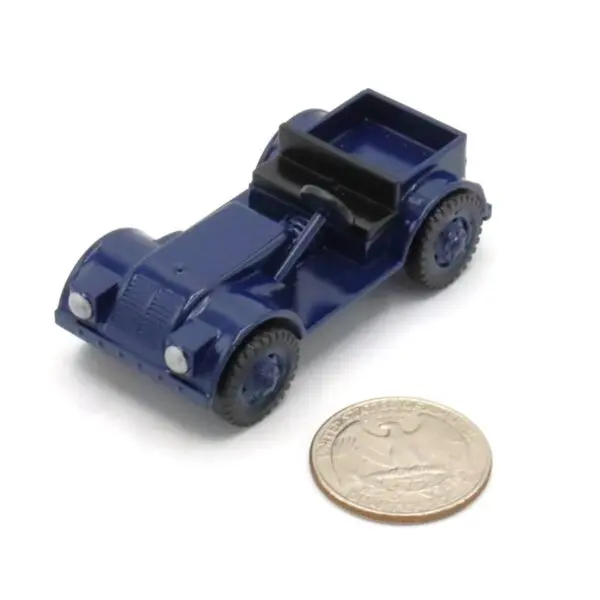 Small blue toy car next to a coin for size comparison.