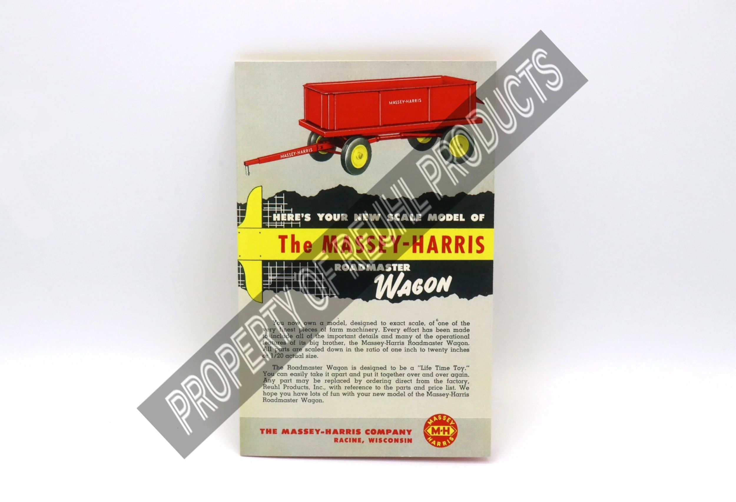 Vintage toy wagon with red trailer and original packaging from The W. H. Harris Company.