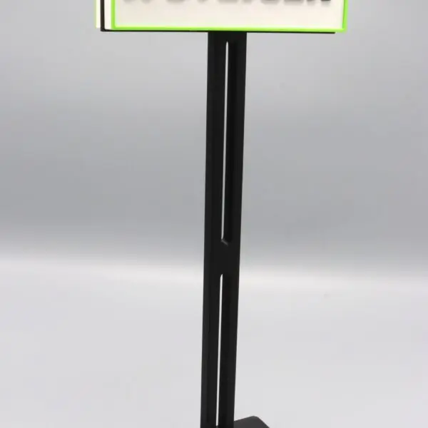 Steiger branded sign on black stand.