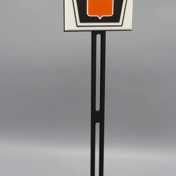 Sign with "Oliver" logo on stand.
