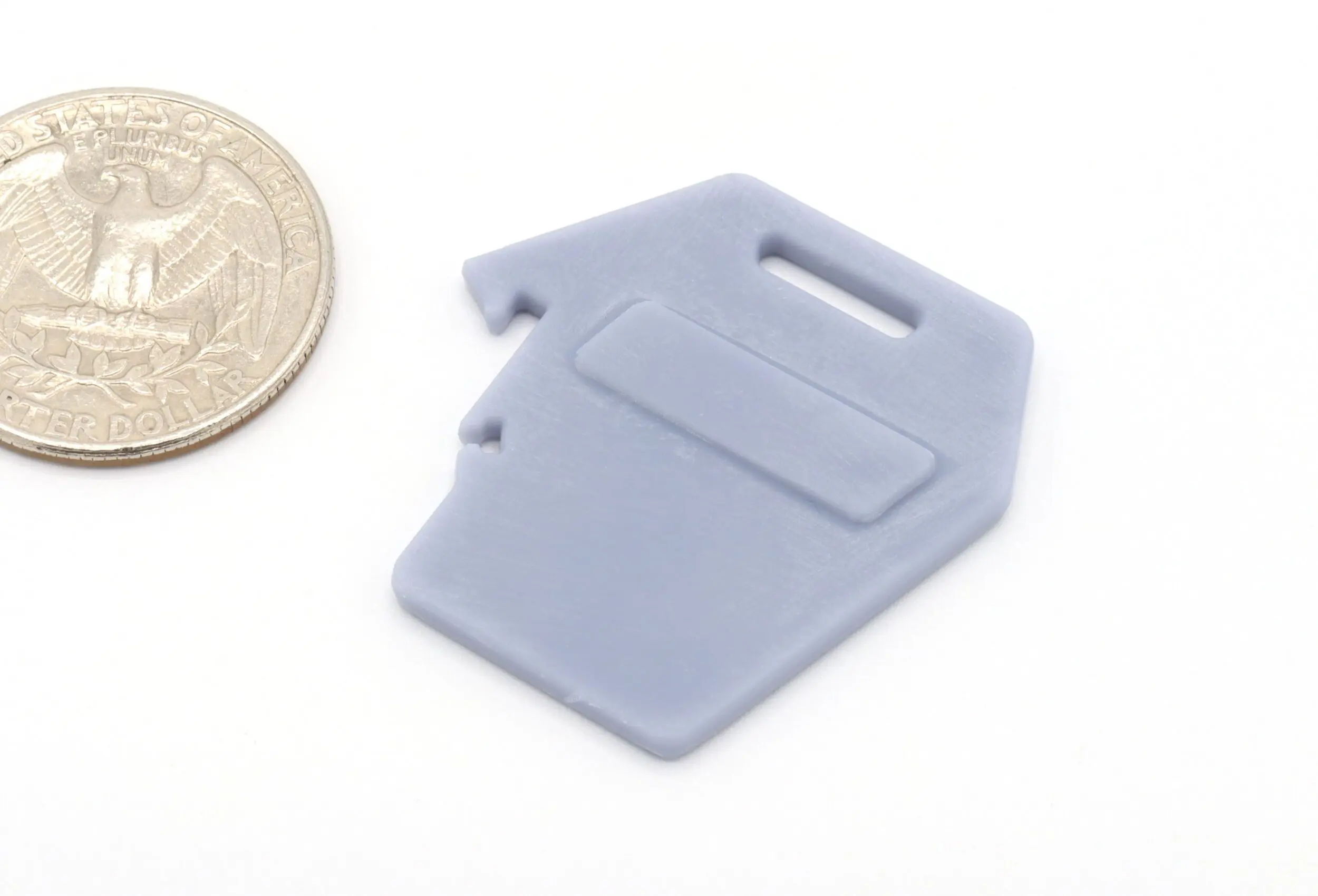 Gray tool and coin on white background.