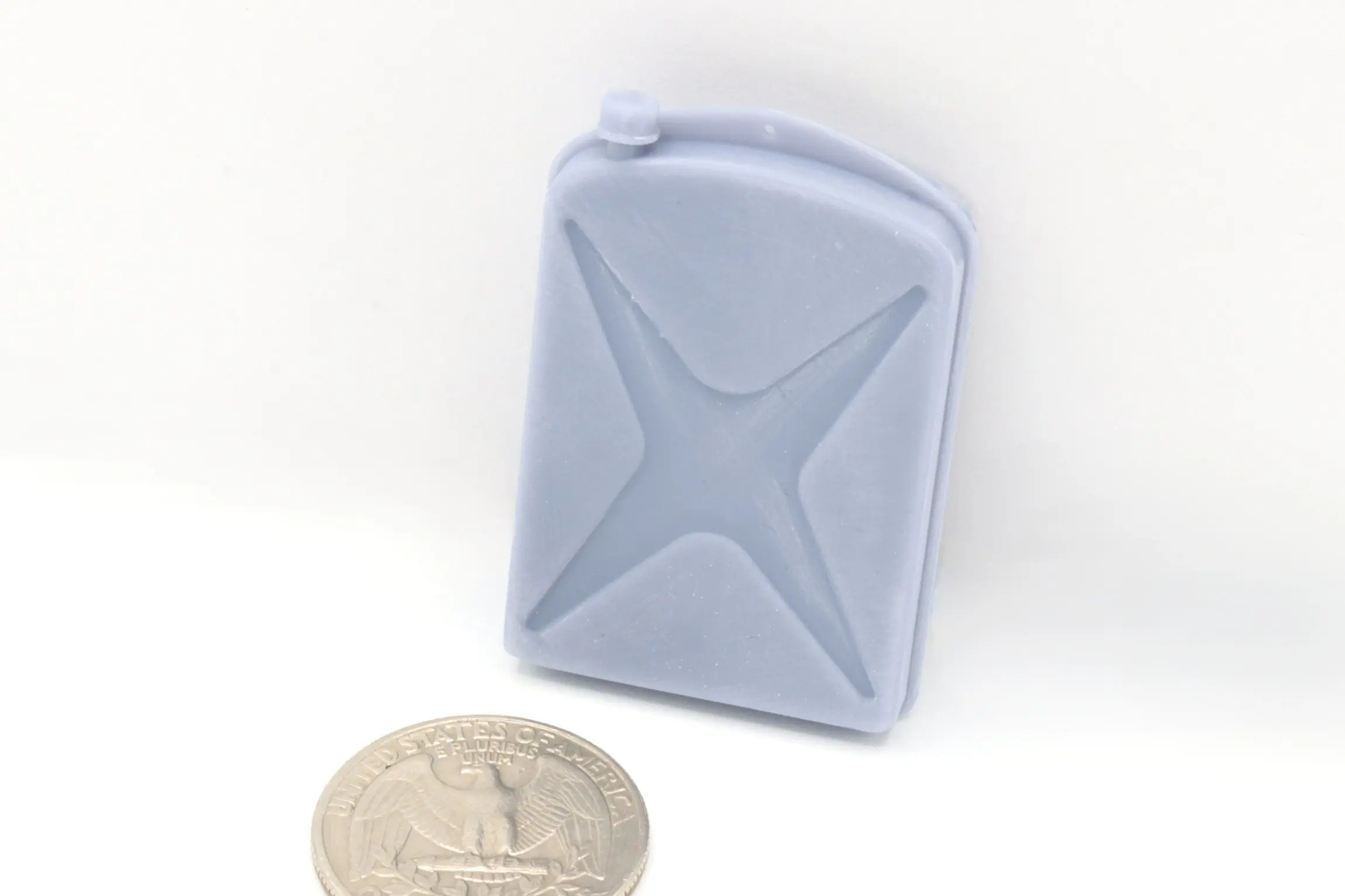 Small gray jerry can beside coin.