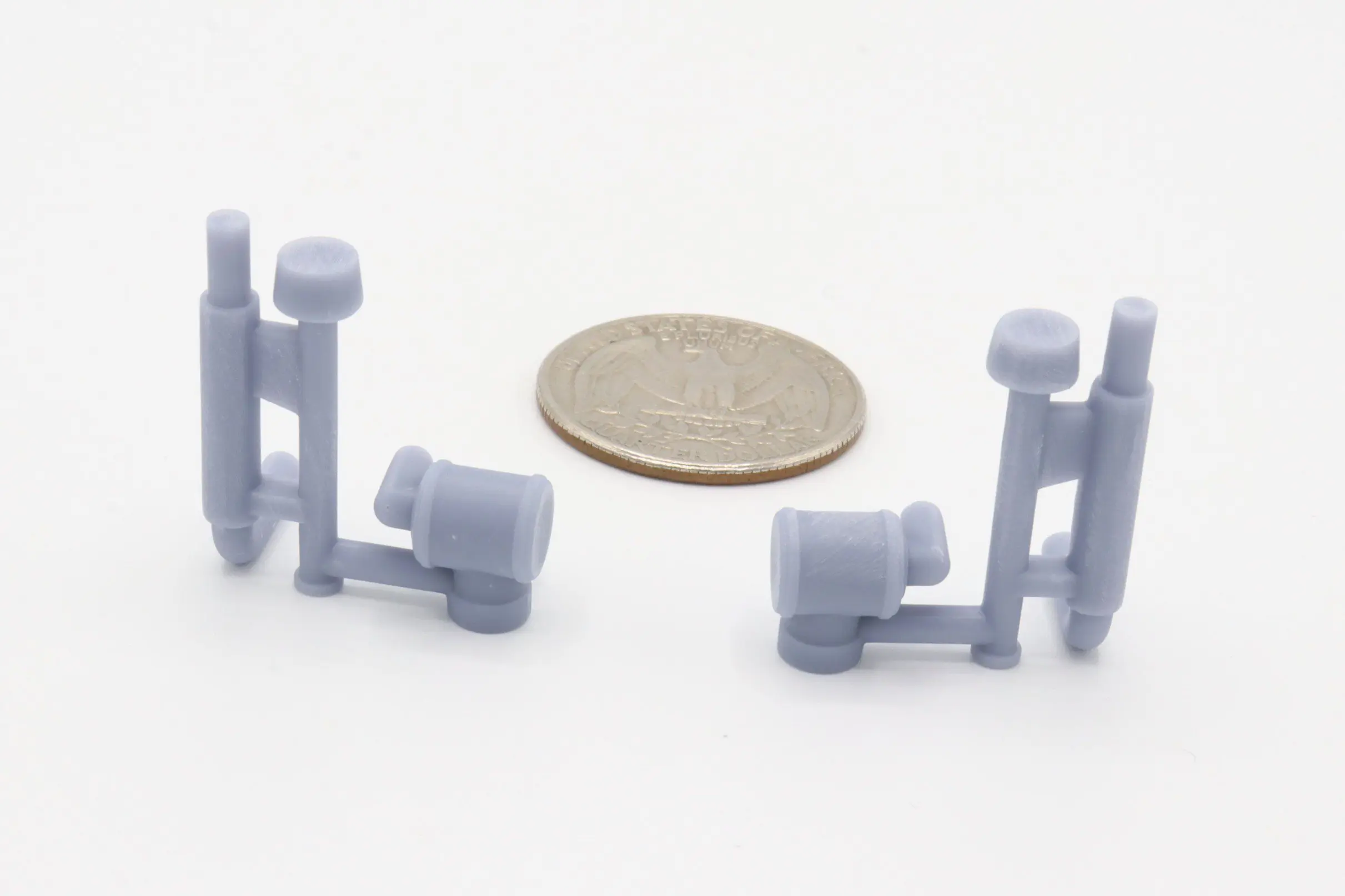 Gray plastic parts with a coin.