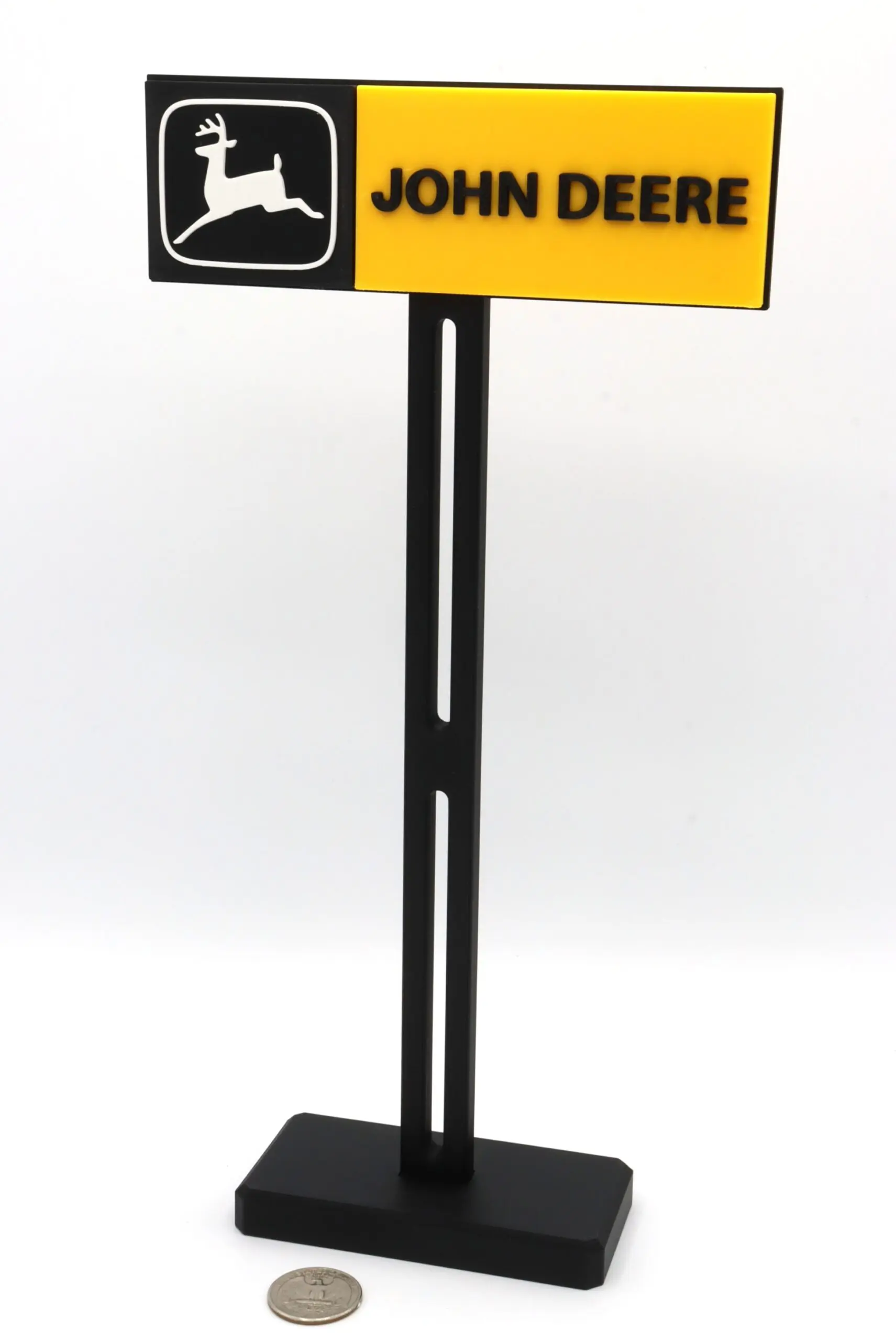 John Deere sign model with coin.